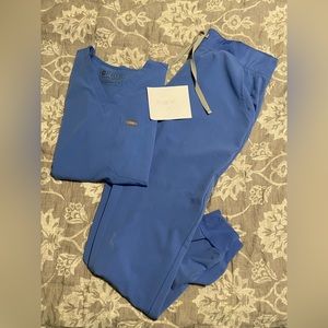 Figs Scrubs with small Rocephin Stain